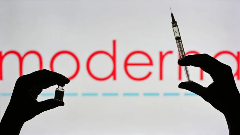 Vaccine vial and injection syringe silhouette with blurred biotech branding
